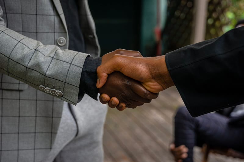 Close-up of two colleagues shaking hands after a successful agreement